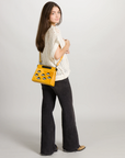 Vali Crossbody Small Golden And Black Leather Bag - Eyes Applique Adjustable Handle